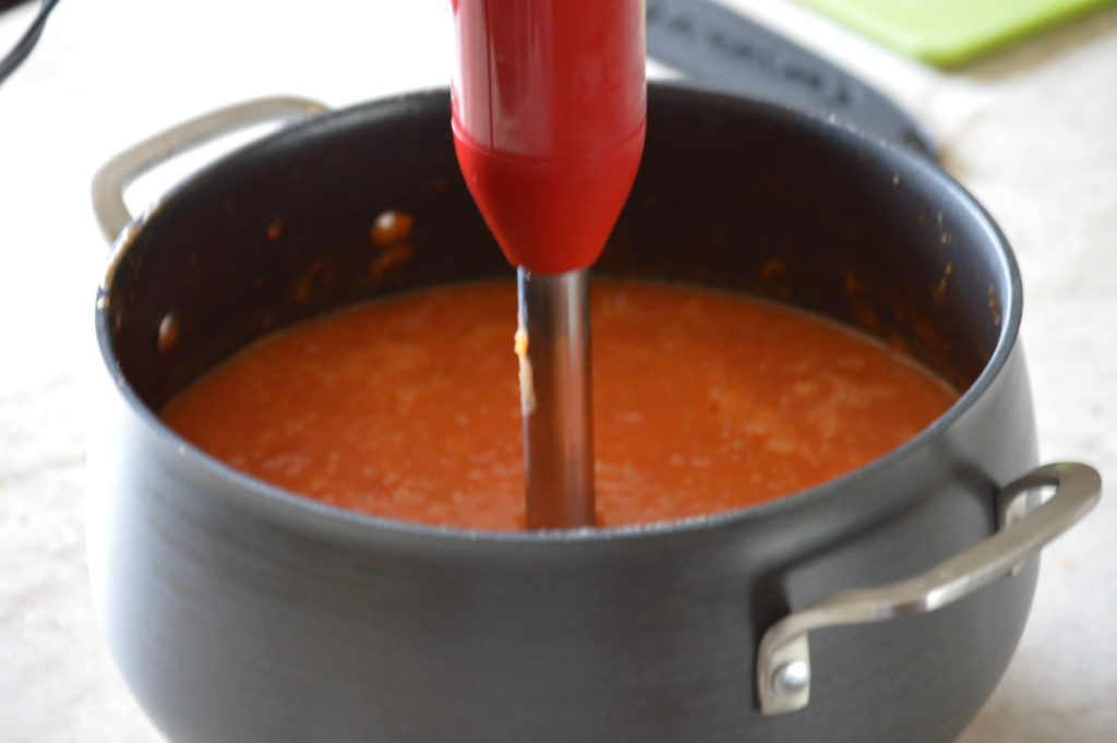 blending the tomato soup until it is smooth