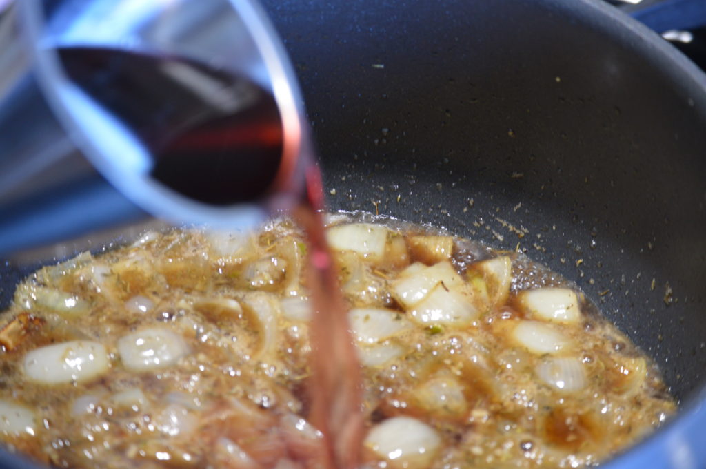 deglazing the pan with red wine