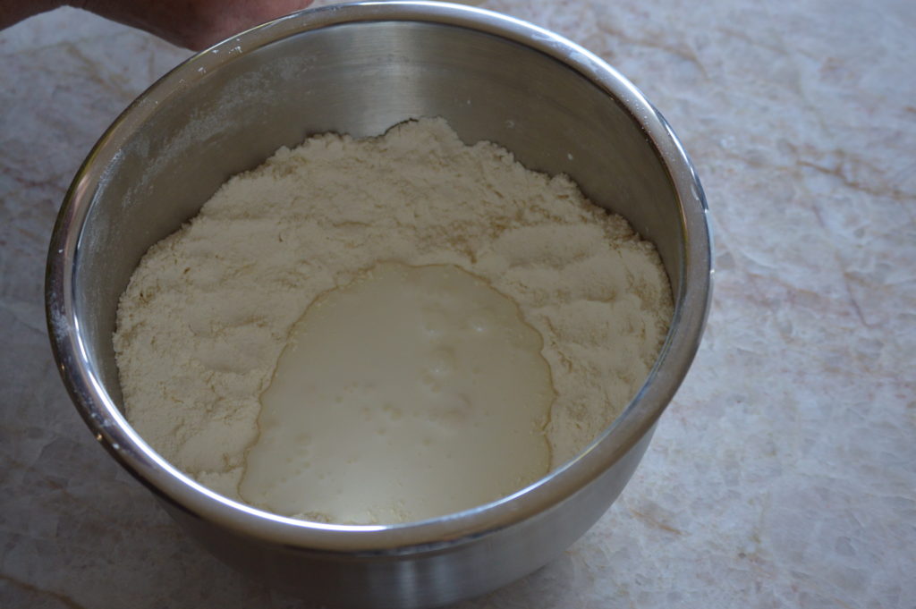 adding the buttermilk to form the soda bread dough