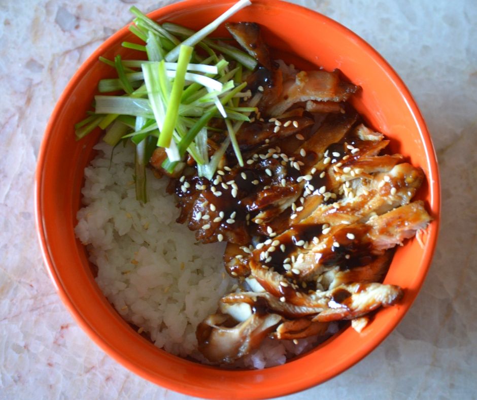 the finished chicken teriyaki in a bowl over rice