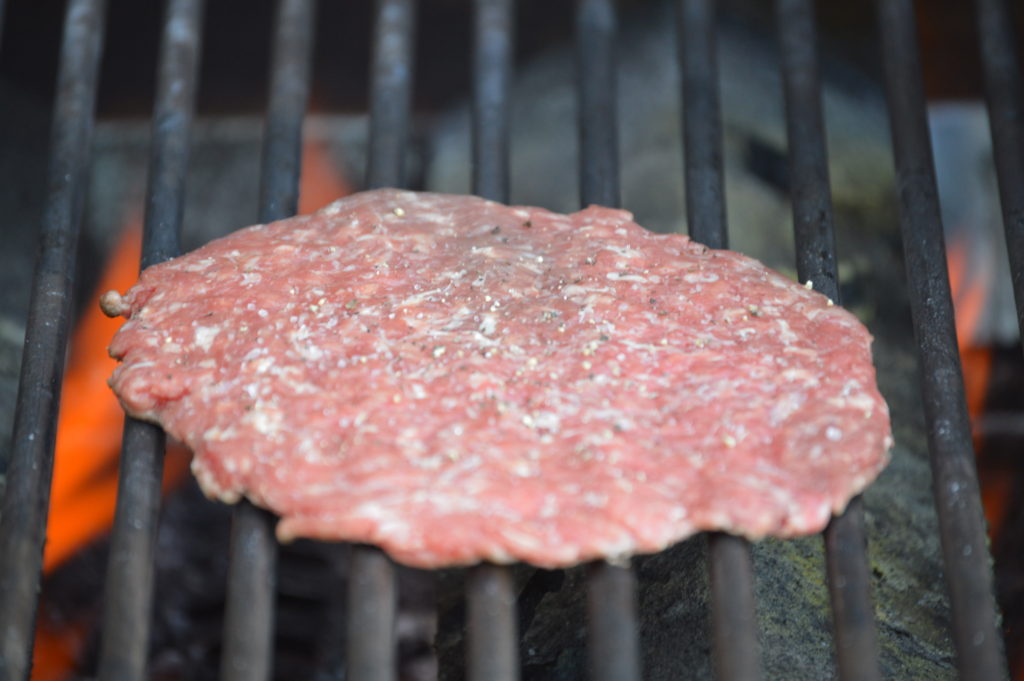 the smashed burger on the grill