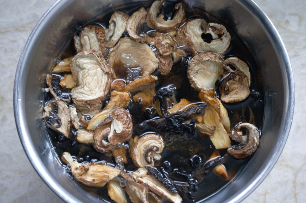 the mushrooms soaking in a bowl