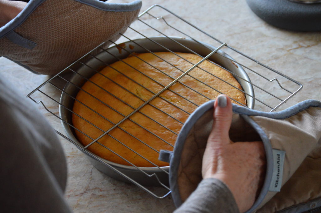 placing the wire rake on top of the cake