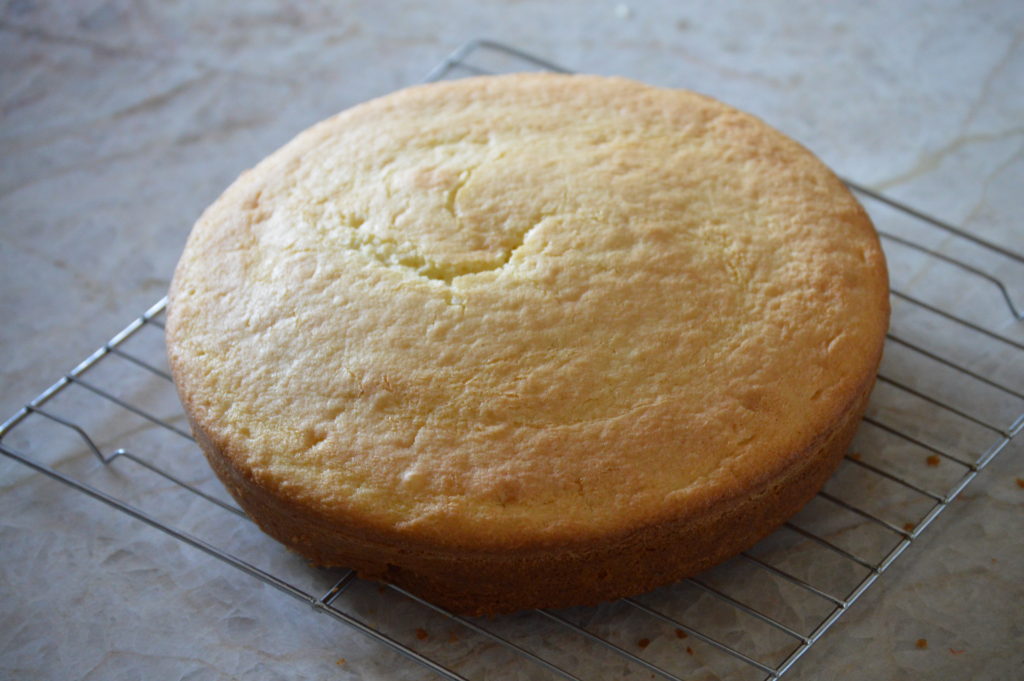 The cake cooling on a wire rack.