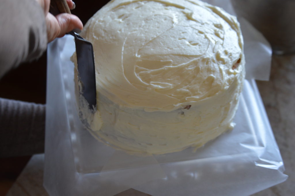 frosting the entire cake.