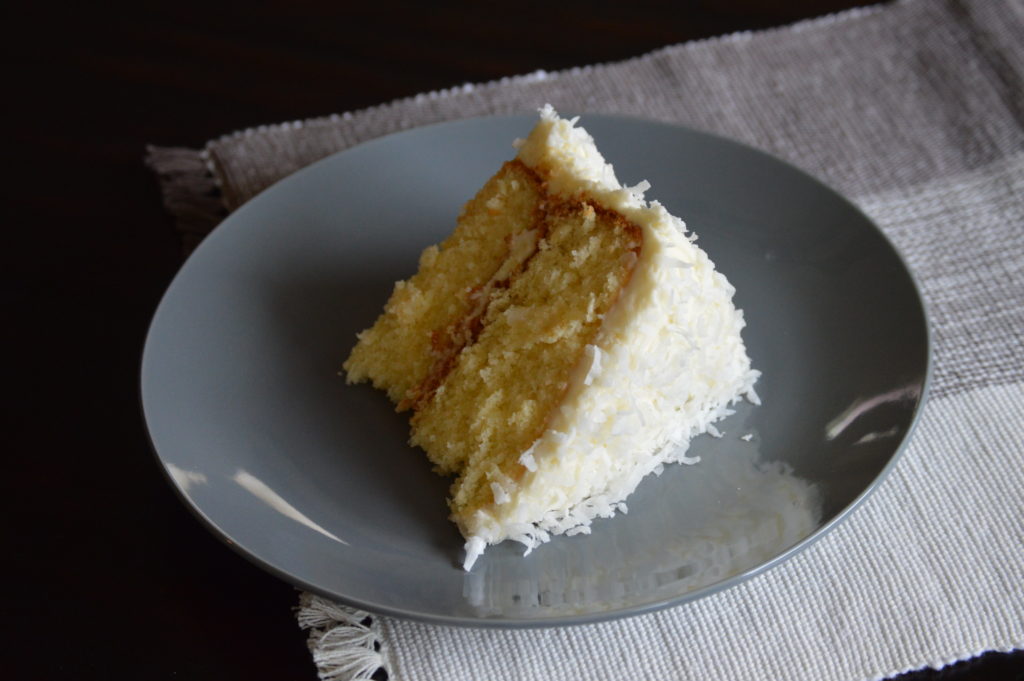 A slice of the layered coconut cake.