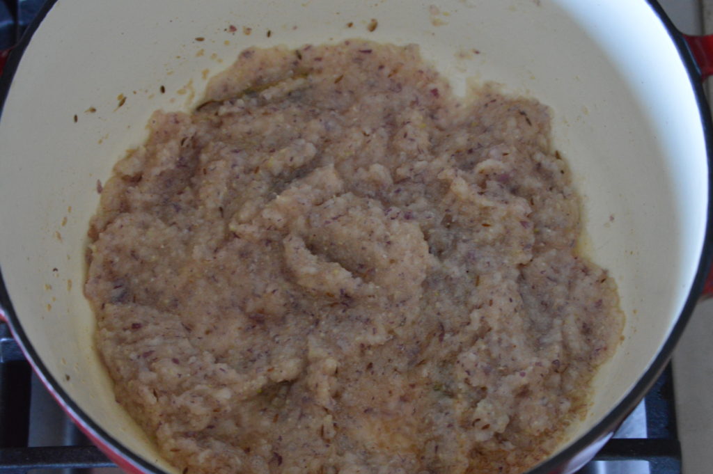 The onion puree added to the masala spice mixture