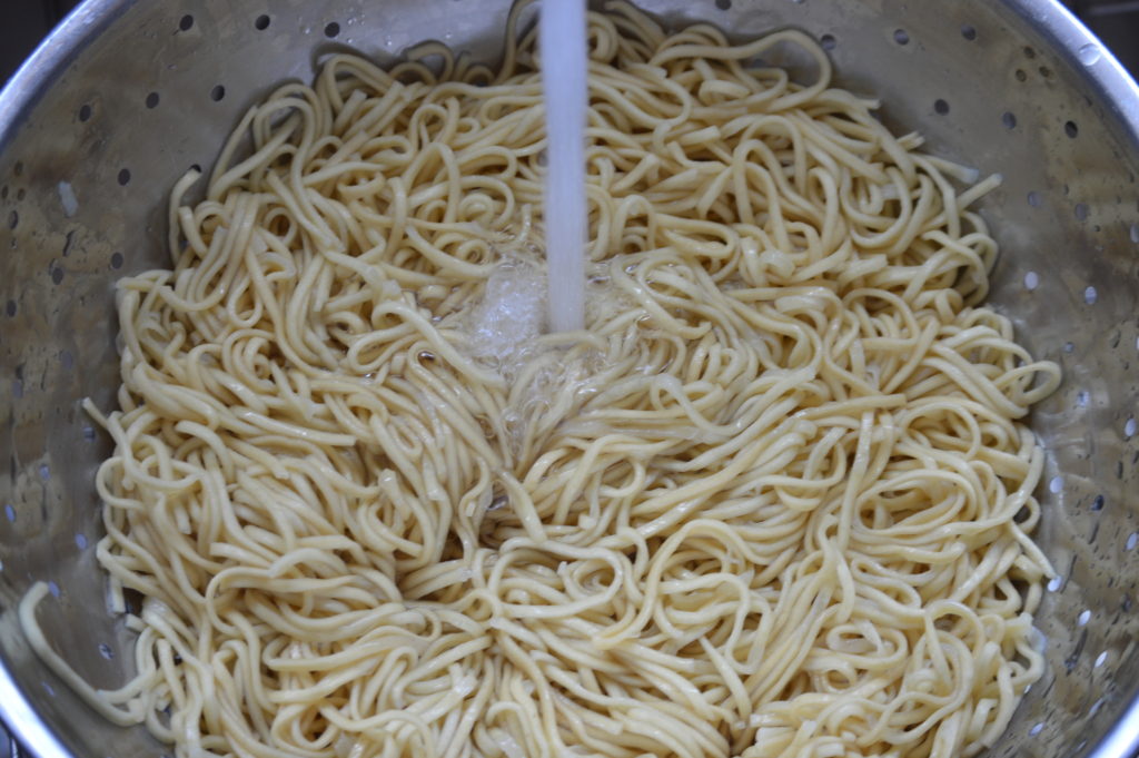 the chow mein noodles after they have boiled