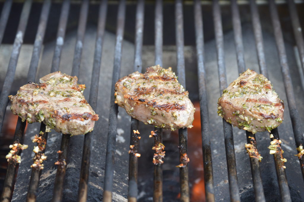 Flipping the lamb chops over on the grill