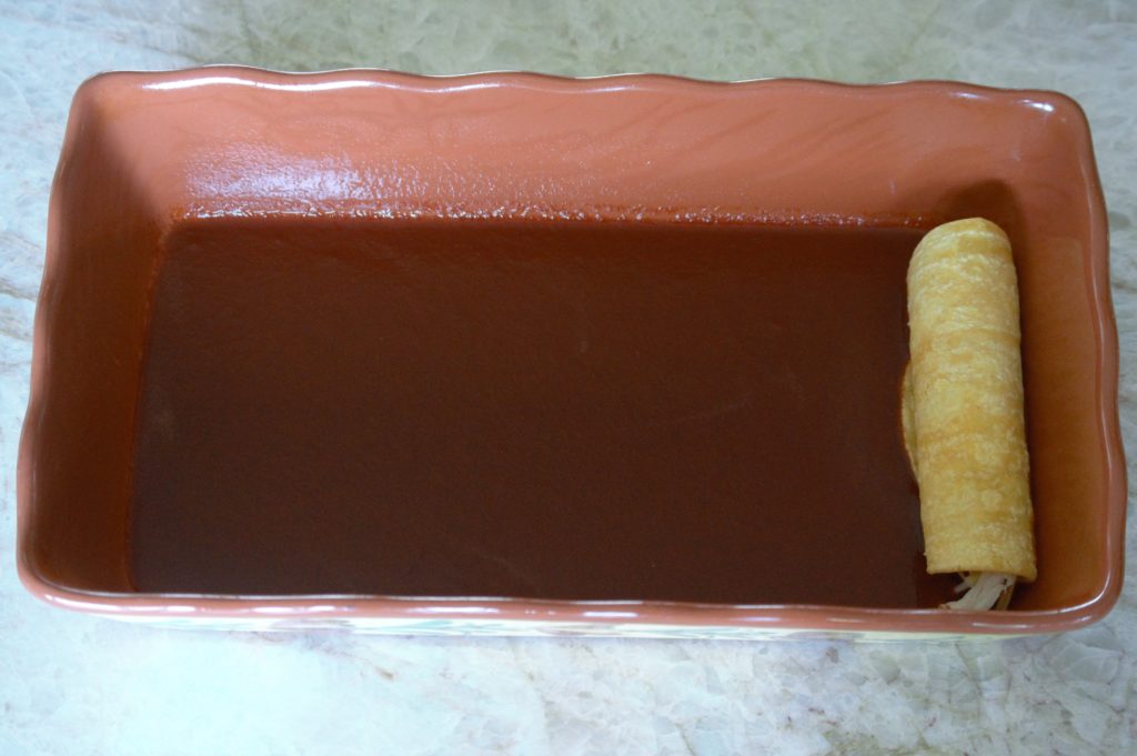 one enchilada in the baking pan
