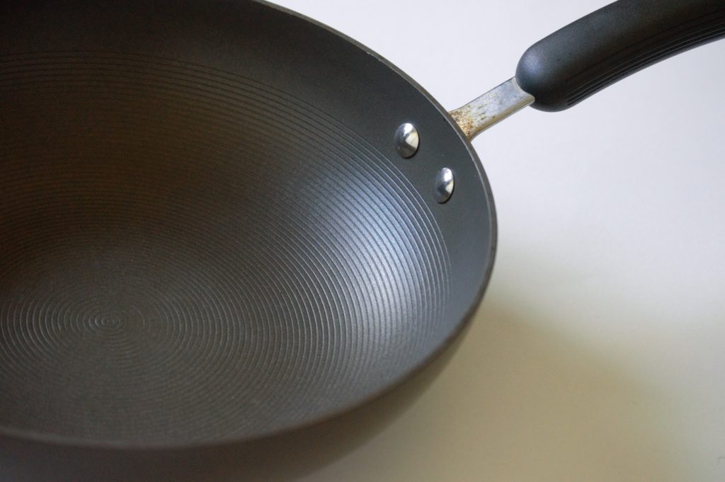 The sides of a wok showing its curved nature