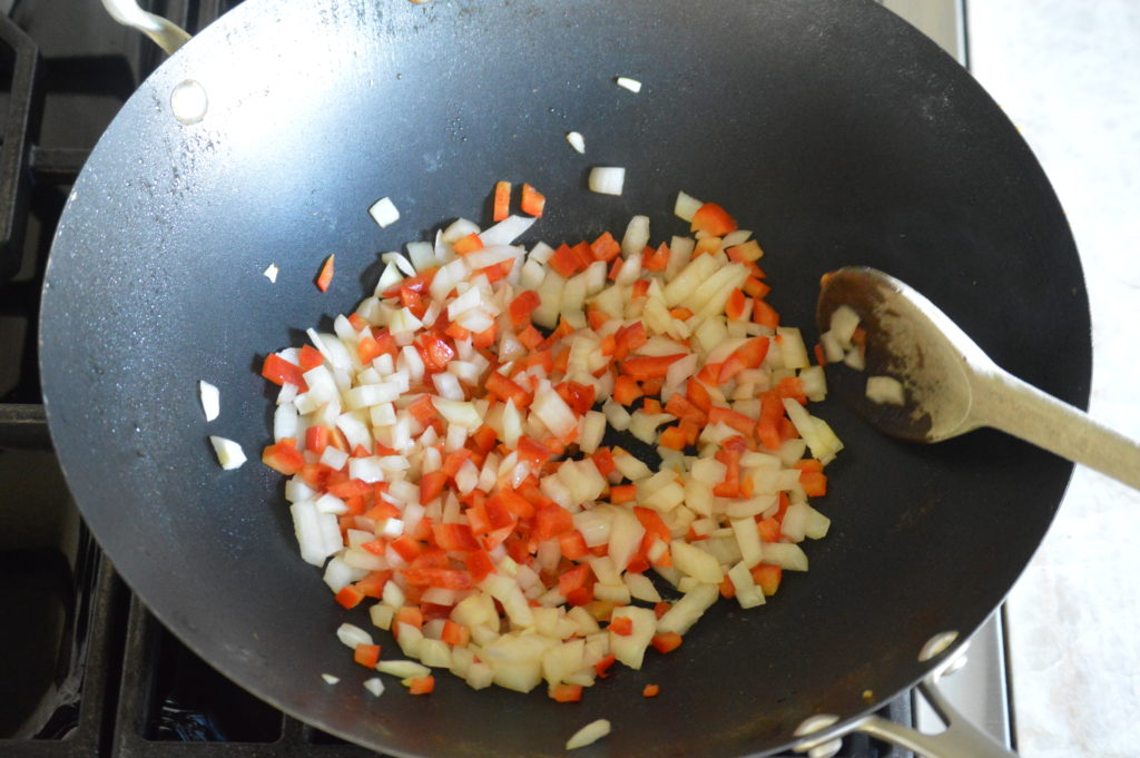 stir frying the onion and bell pepper
