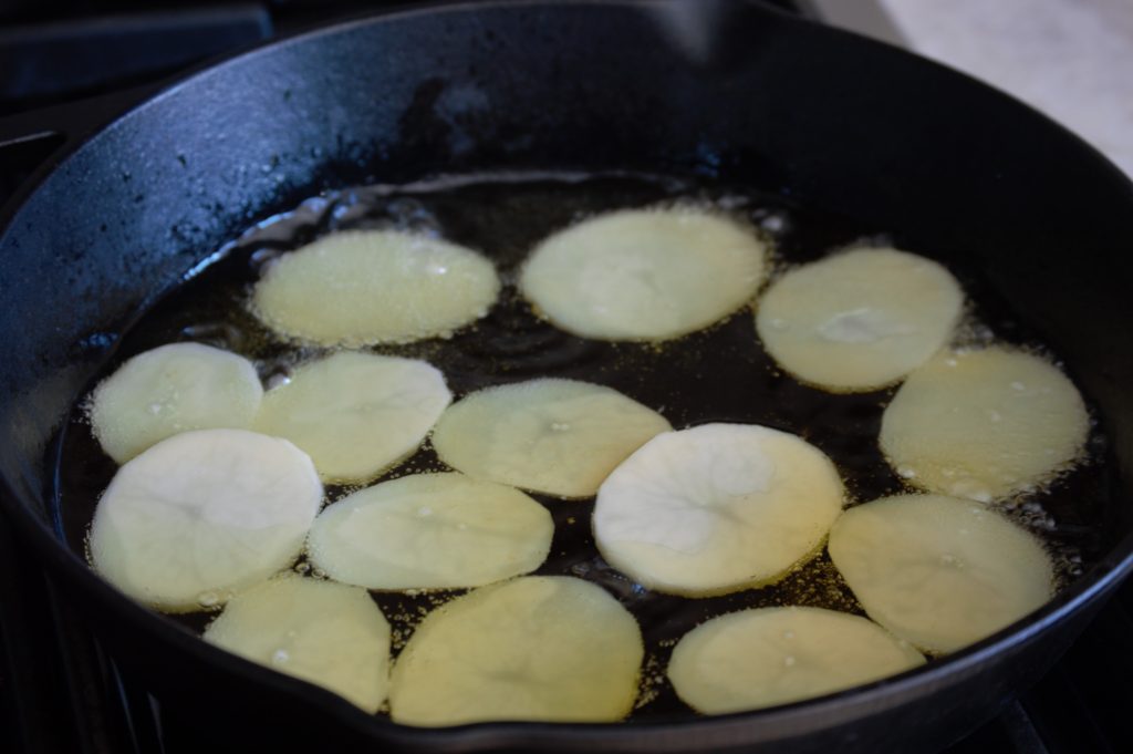 frying up the potatoes
