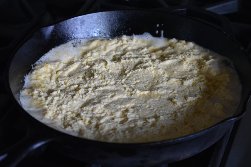 the southern cornbread in the hot skillet