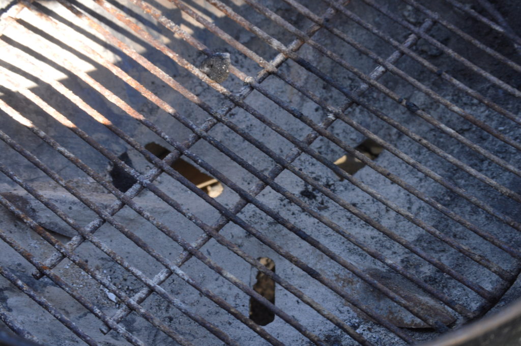 the wholes at the bottom of the charcoal grill