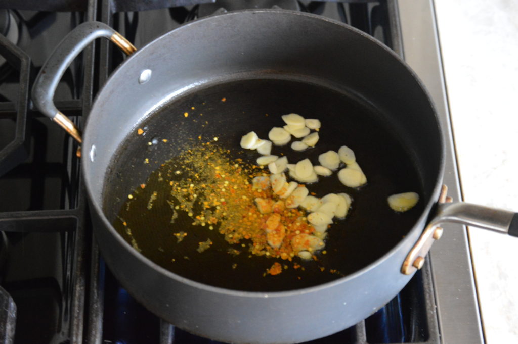 frying the garlic and chili pepper