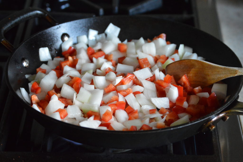 cooking up the onions and bell pepper