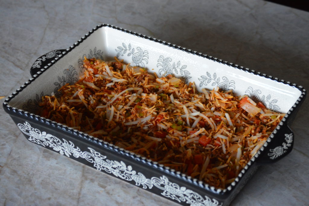 the southwest breakfast casserole filling in the baking dish