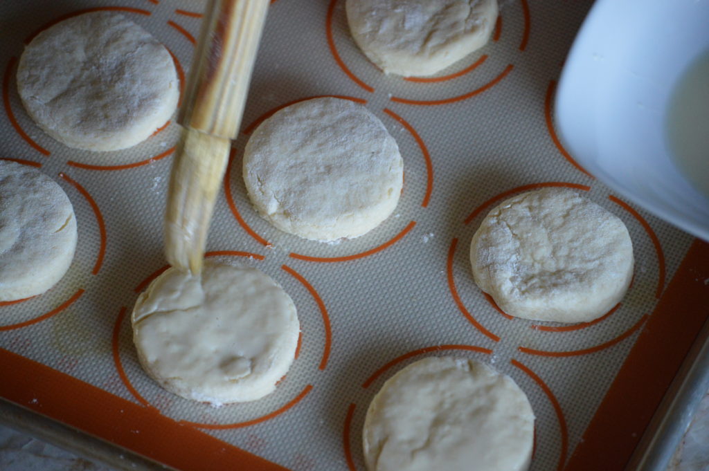 brushing the English scones with egg wash