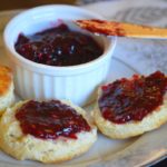 the finnished four berry jam on some scones