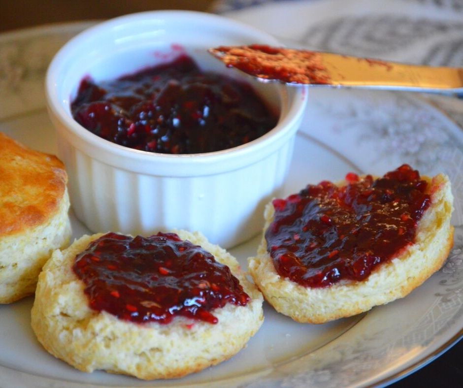 the finnished four berry jam on some scones