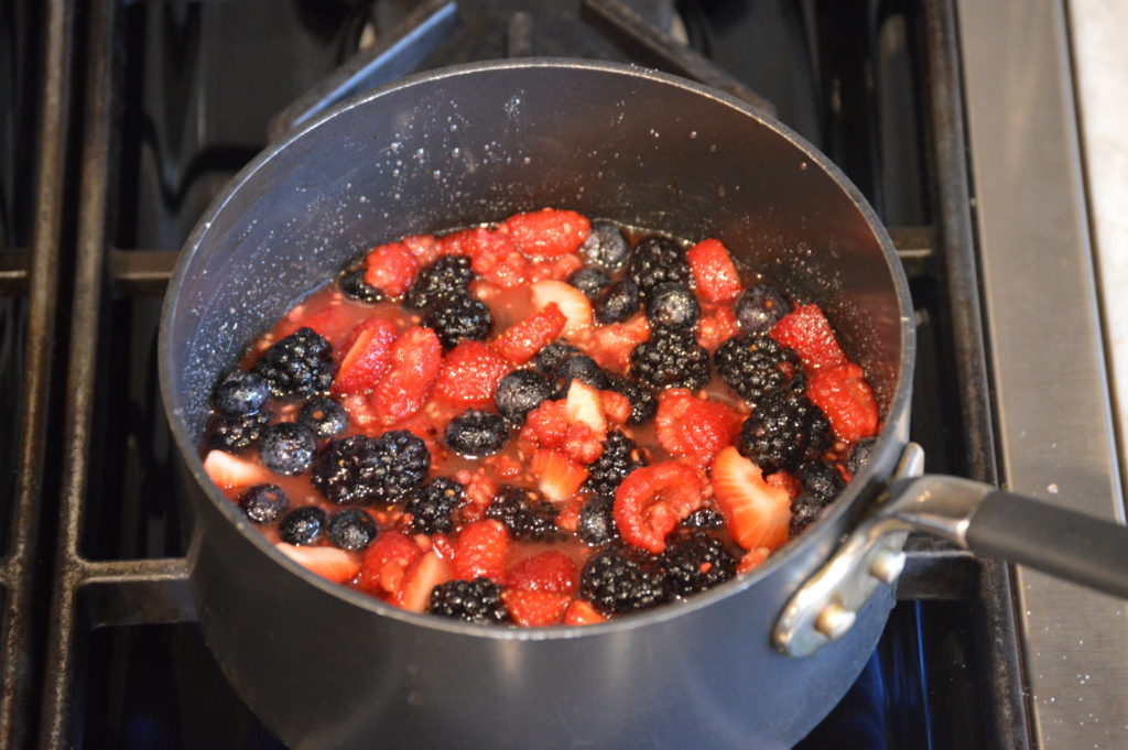 the berries sugar and lemon juice in a pot