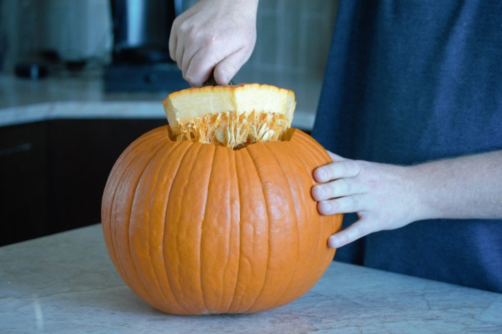 cupping a hole into the pumpkin top