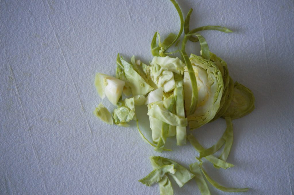 cutting the brussels sprouts into strips