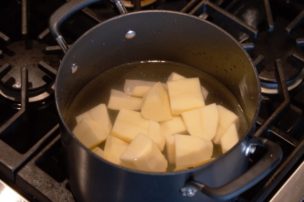 the potatoes in a pot filled with water