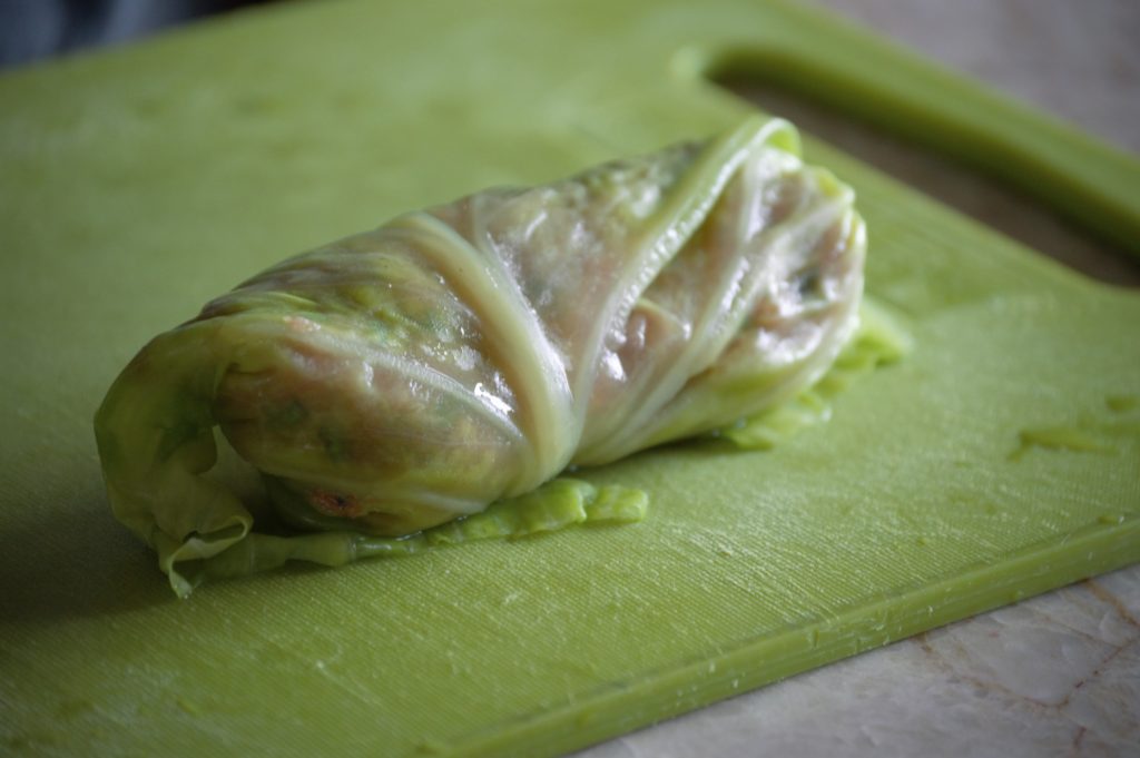 an uncooked cabbage roll