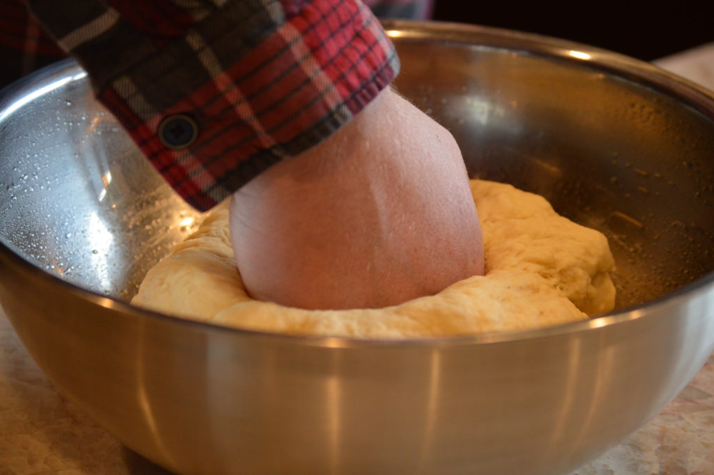 pounding the dough down
