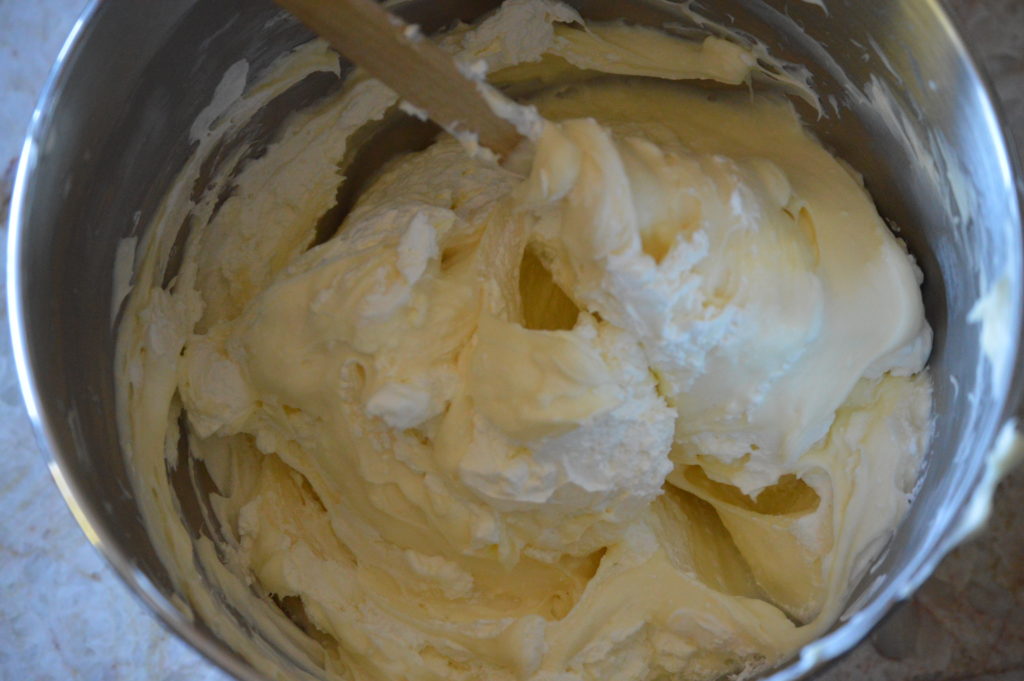folding the whipped cream into the cheesecake mixture