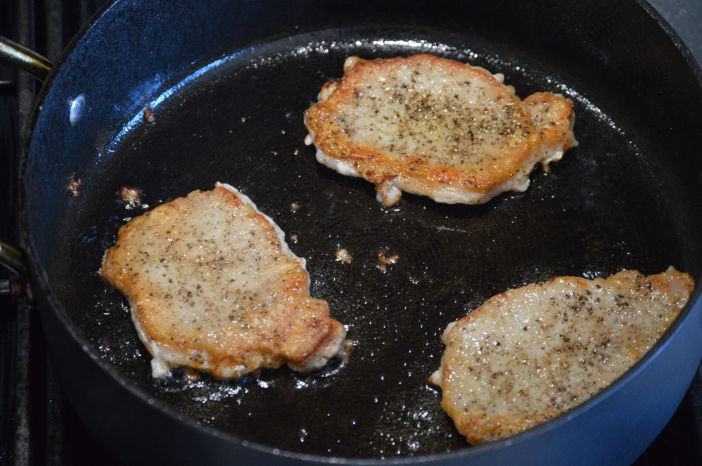 browning up the pork chops