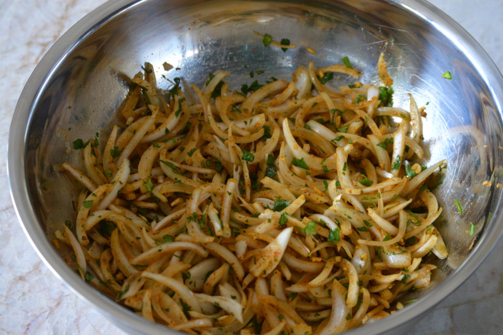 the onions and spices in a bowl