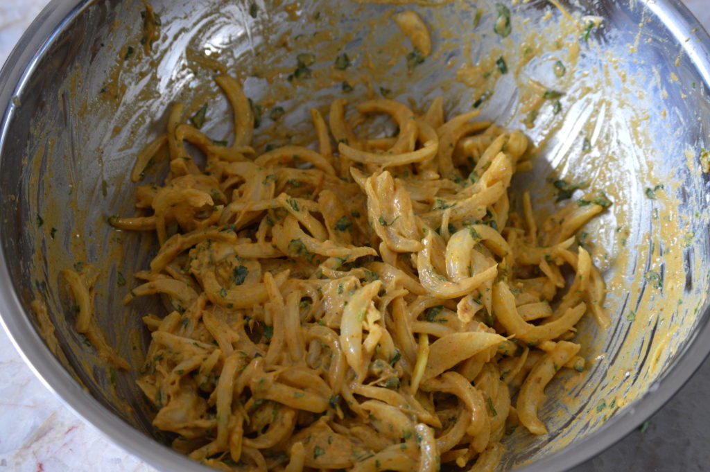 the onion pakoras ready to be fried