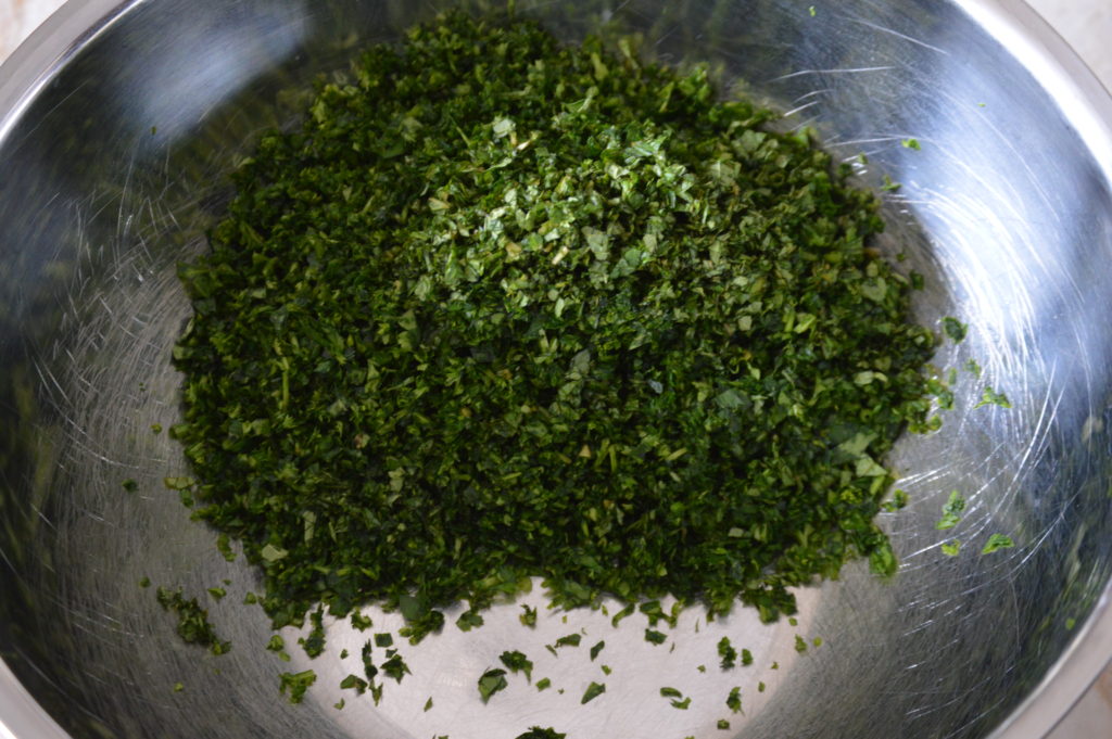 the chopped parsley and mint which is the base of the tabbouleh 
