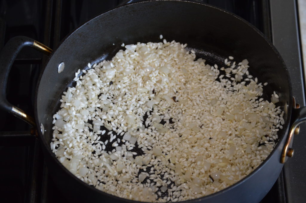 the onion garlic and rice in the skillet