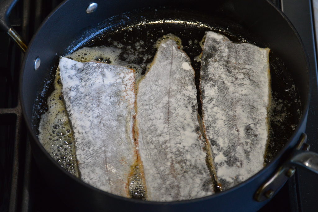 frying the trout on one side