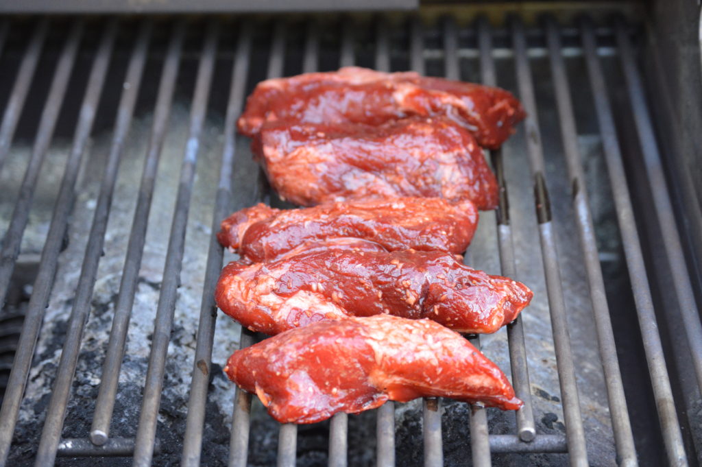 the char siu is on the grill