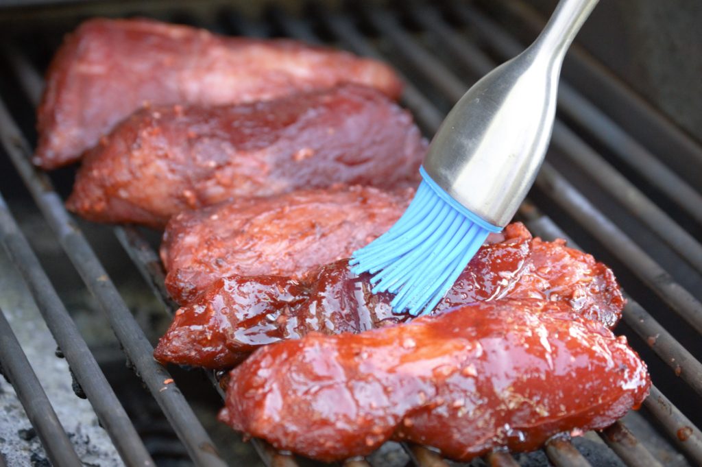 brushing on the basting sauce