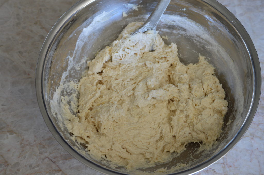 mixing the dough together with a wooden spoon