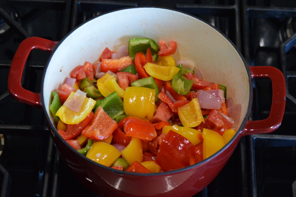 the peppers and tomatoes added to the pot