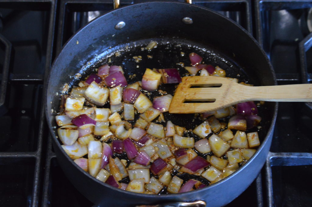 sauteing the onion, garlic, and ginger