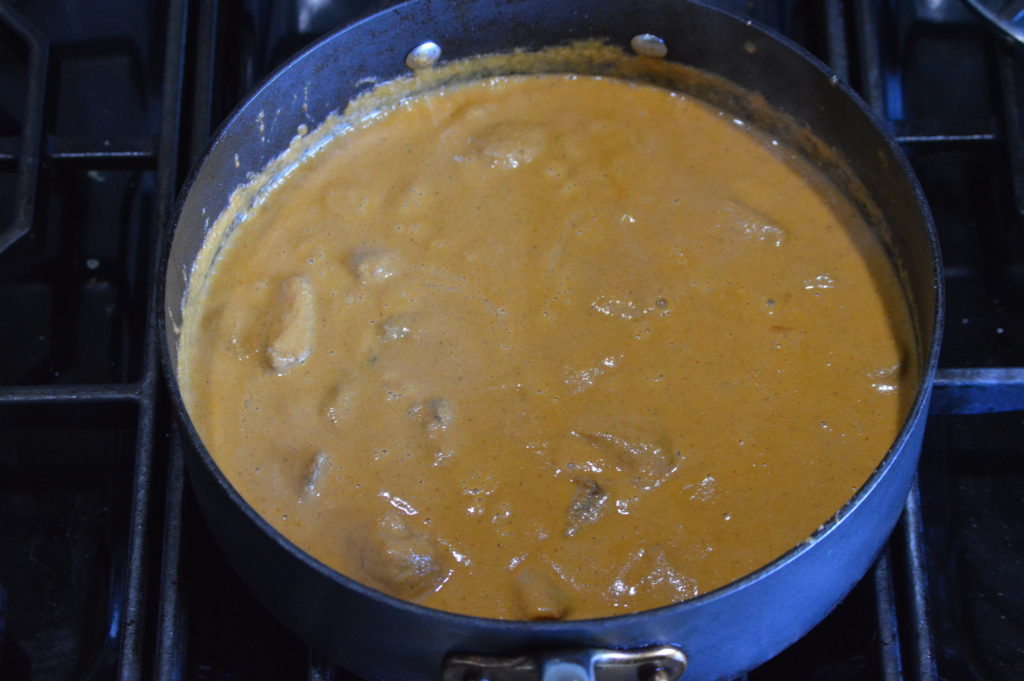 the chicken finished cooking in the curry sauce