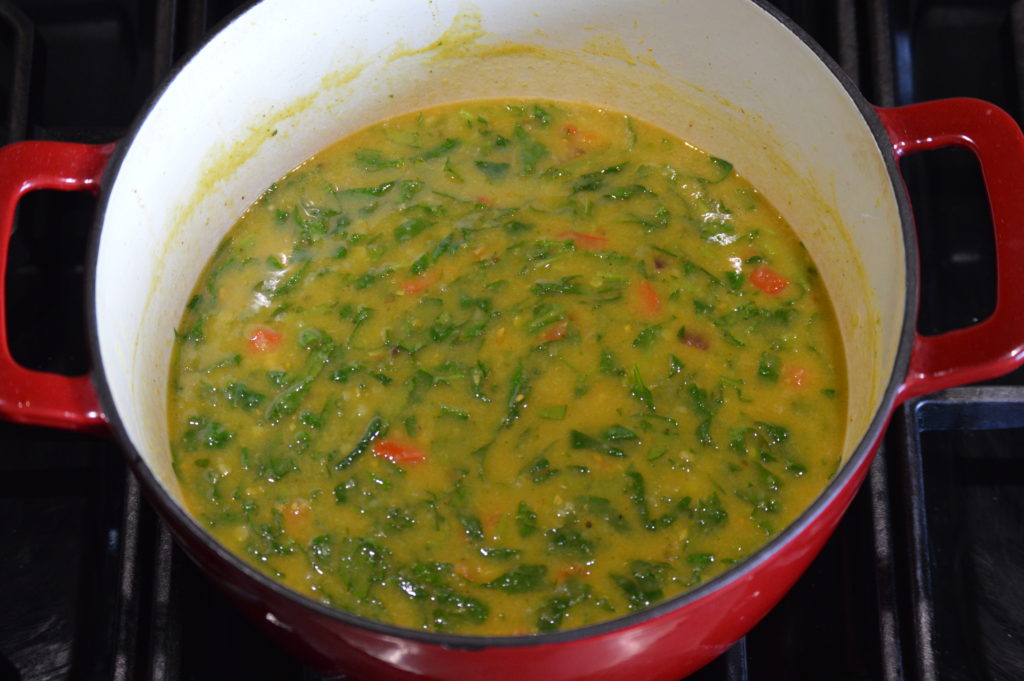 the lentils, spinach, and tomatoes added and cooked