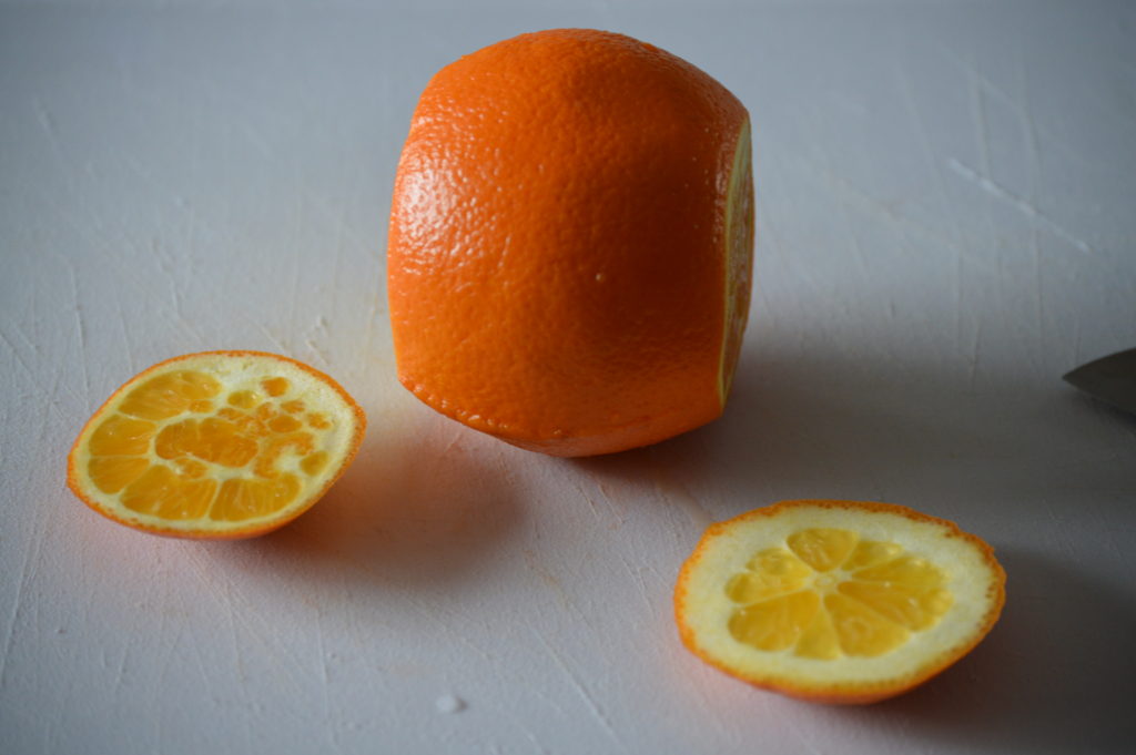 the top and bottom cut off of an orange