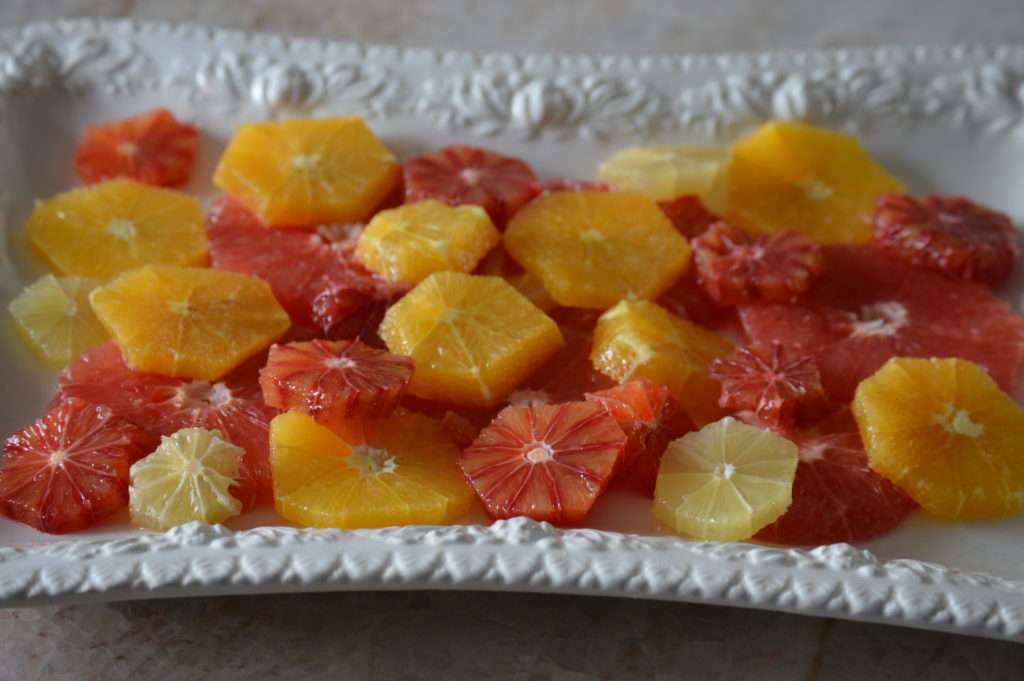 the citrus fruit cut and arranged on a plater