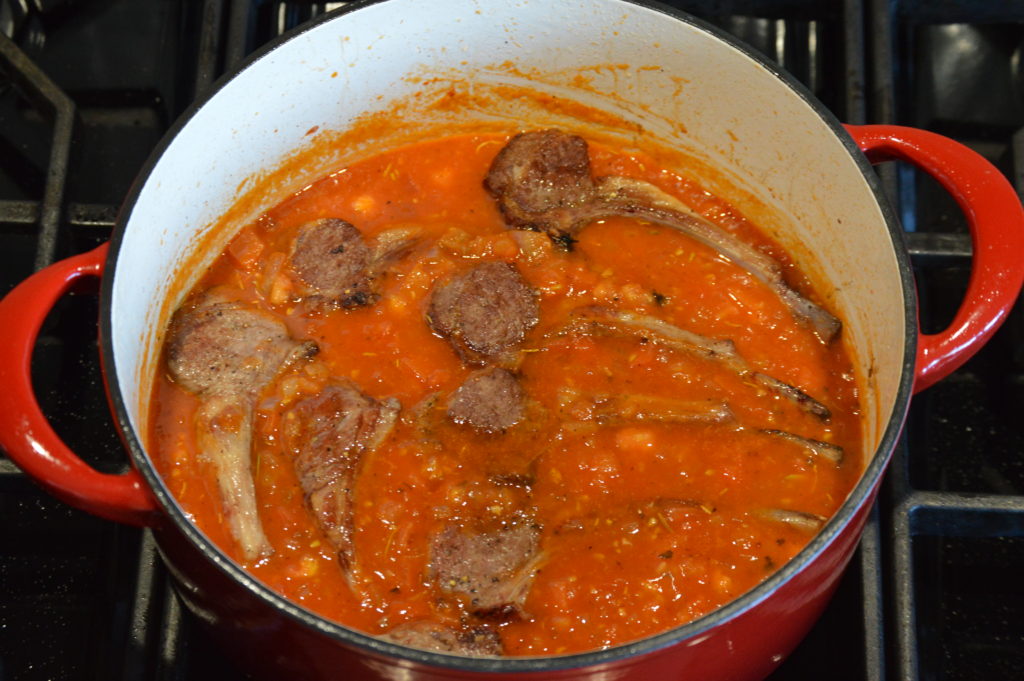 the lamb chops are added to the tomato sauce