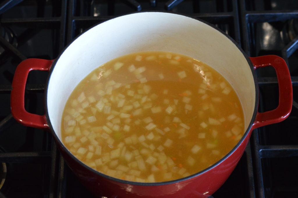 the stock barley and carrots are added to the pot