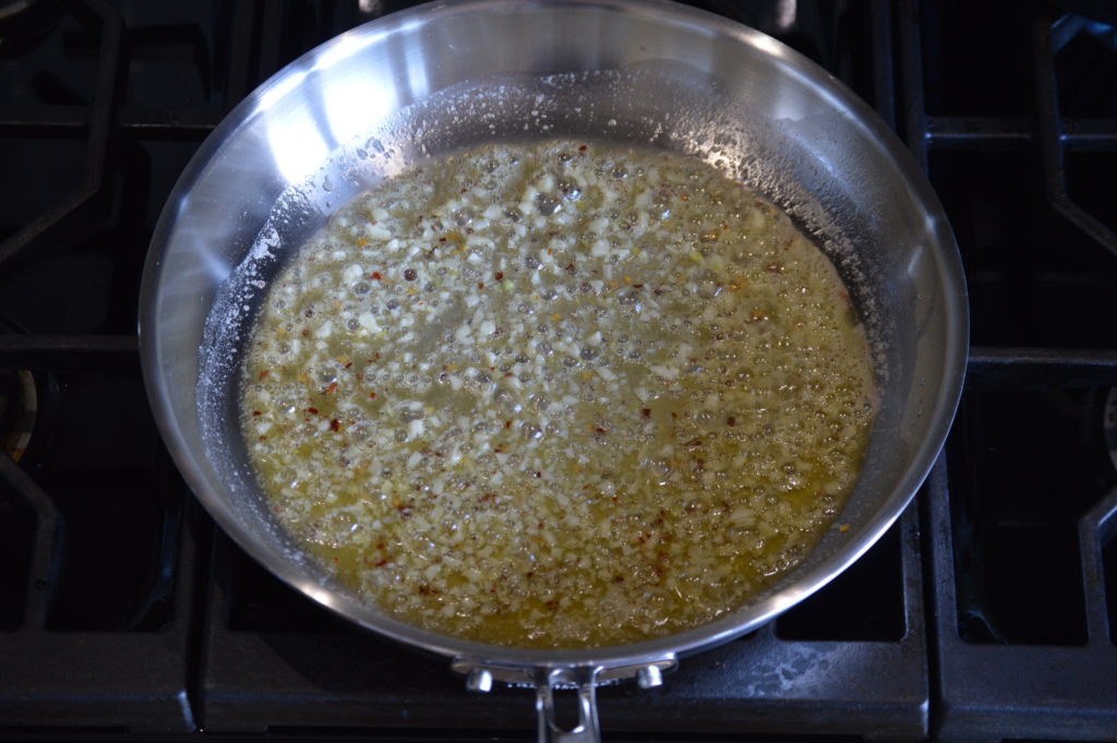 sauteing the garlic and chili flakes in the butter and oil
